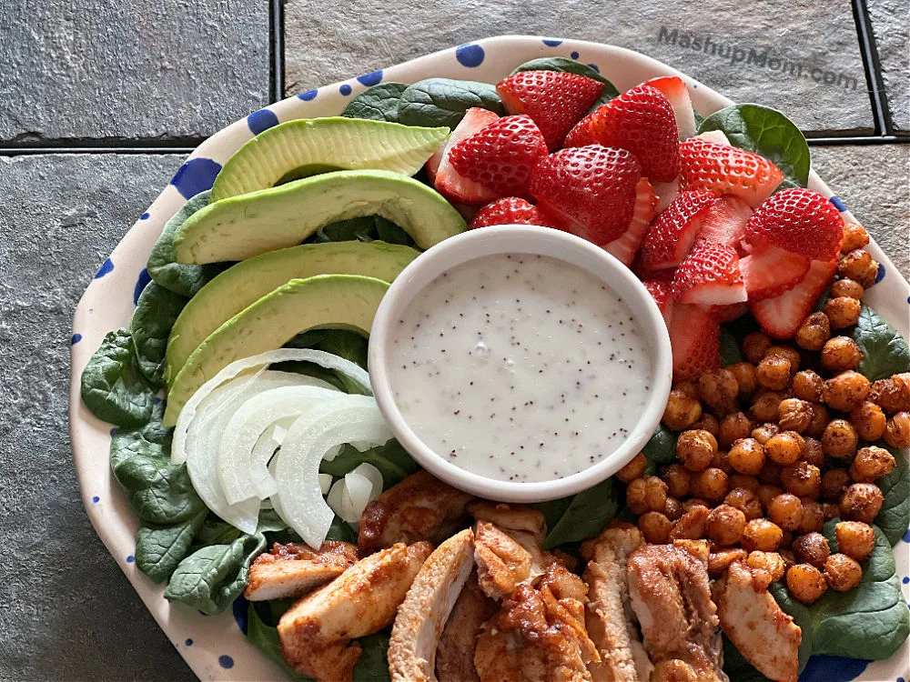 spinach salad with strawberries chicken chickpeas and avocado